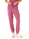 Women wearing Margot Feather Fleece Cargo Joggers in berry, showing the relaxed knit fit and side cargo pocket detail.