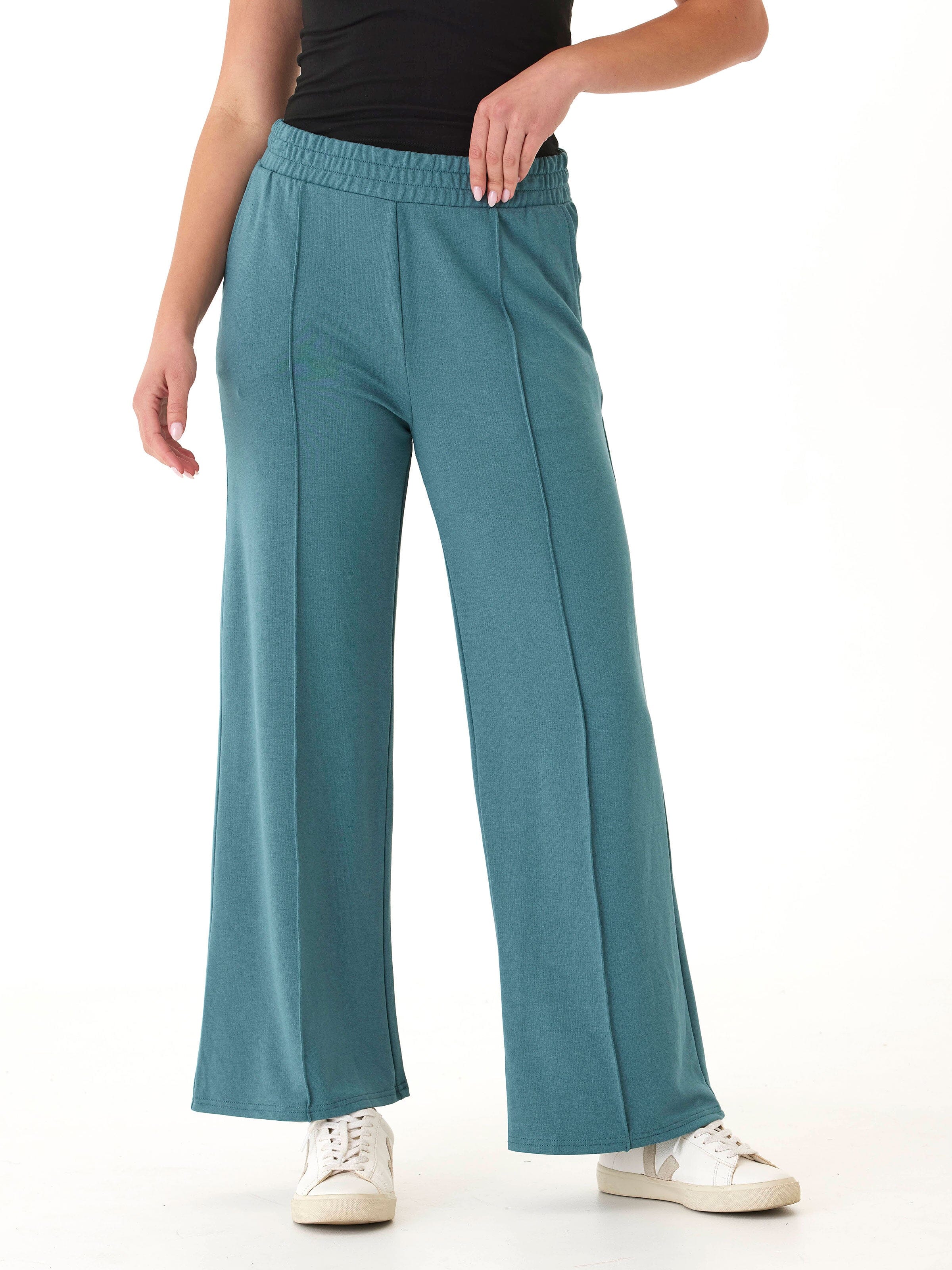 Woman wearing Angela Modal Terry high-rise wide-leg pants in muted teal in a relaxed loungewear style