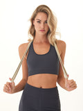 Charcoal-grey sports bra with a flattering scoop neckline and detailed strappy back