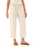 Woman wearing comfortable wide-leg jersey capri pants with smocked elastic waistband and side pockets