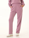 Woman wearing Neve Triblend Fleece high-rise straight-leg lounge pants in mauve
