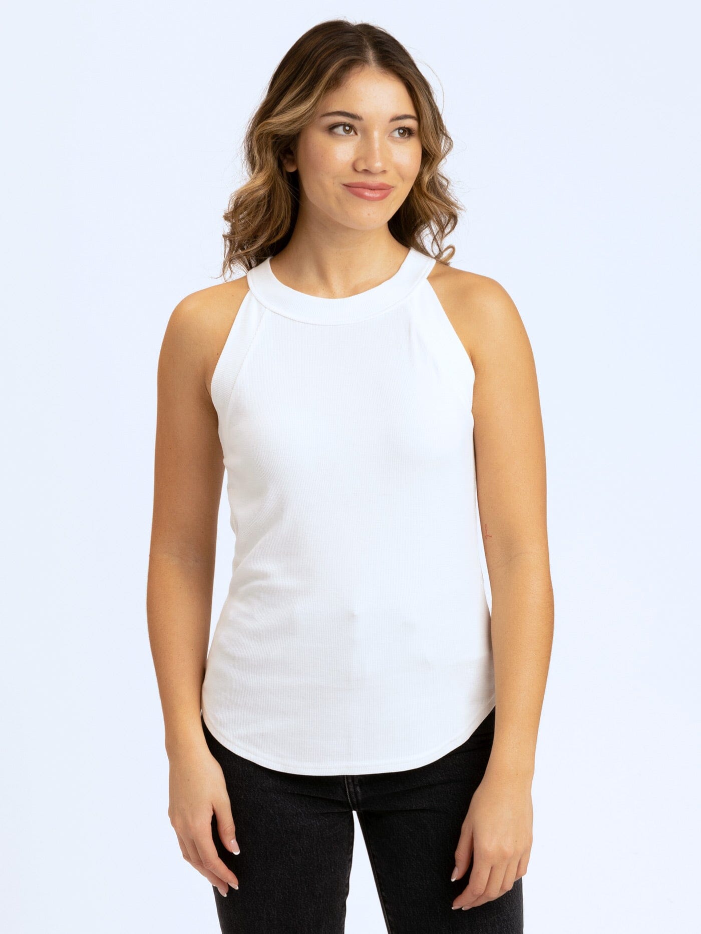 Model wearing a high neck Maresia Feather Rib Tank in a relaxed, comfortable fit.