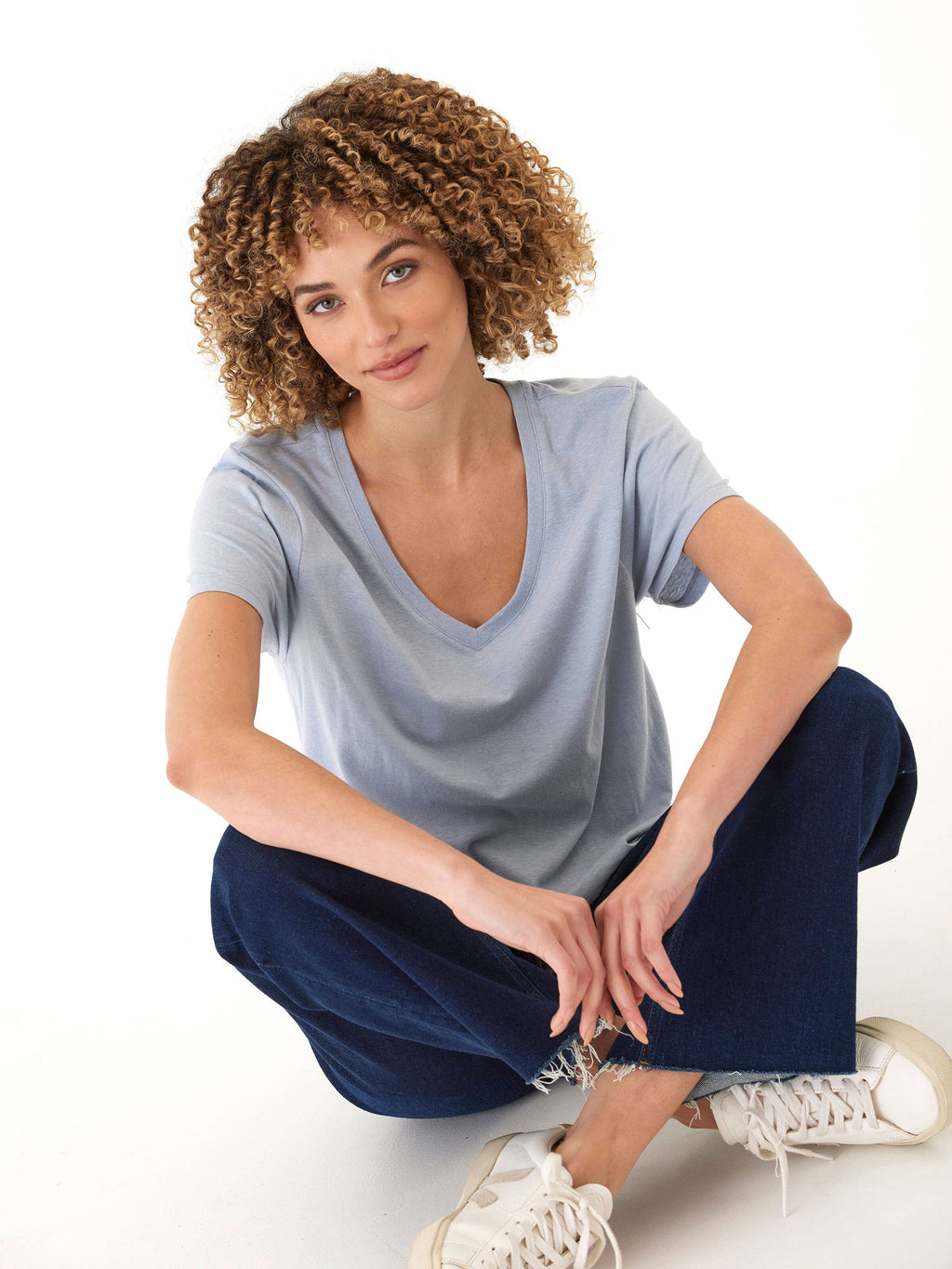 Close up of a light blue women's V-neck t-shirt in soft triblend jersey fabric