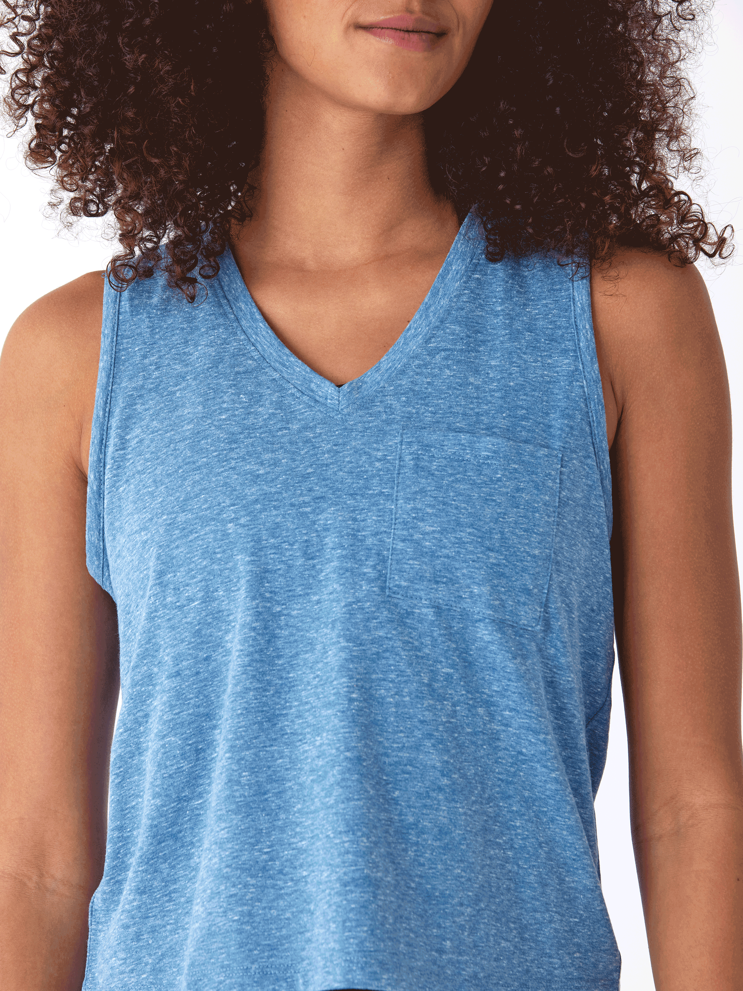 Woman wearing a comfortable relaxed fit Hera Triblend Jersey V-Neck Tank in a casual setting