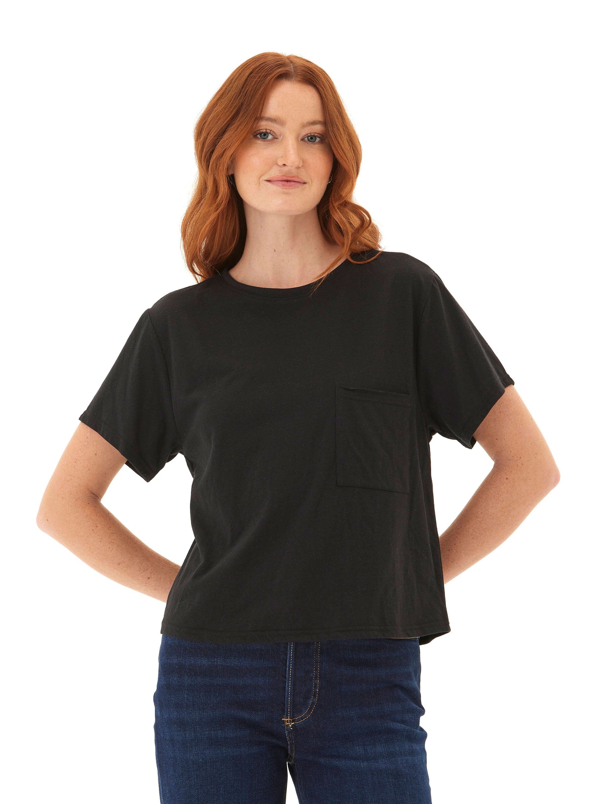 Women wearing a black Core Triblend Jersey Pocket Tee with a relaxed fit and crew neckline.