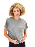 Close-up of a heathered medium grey relaxed fit knit pocket tee with a crew neckline.