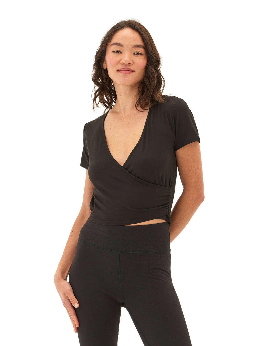 A feminine Faylinne Heather Luxe Jersey Wrap Tee featuring a flattering, chic draped design.