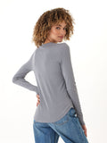 Woman wearing a grey Torri Feather Rib long sleeve crew neck tee