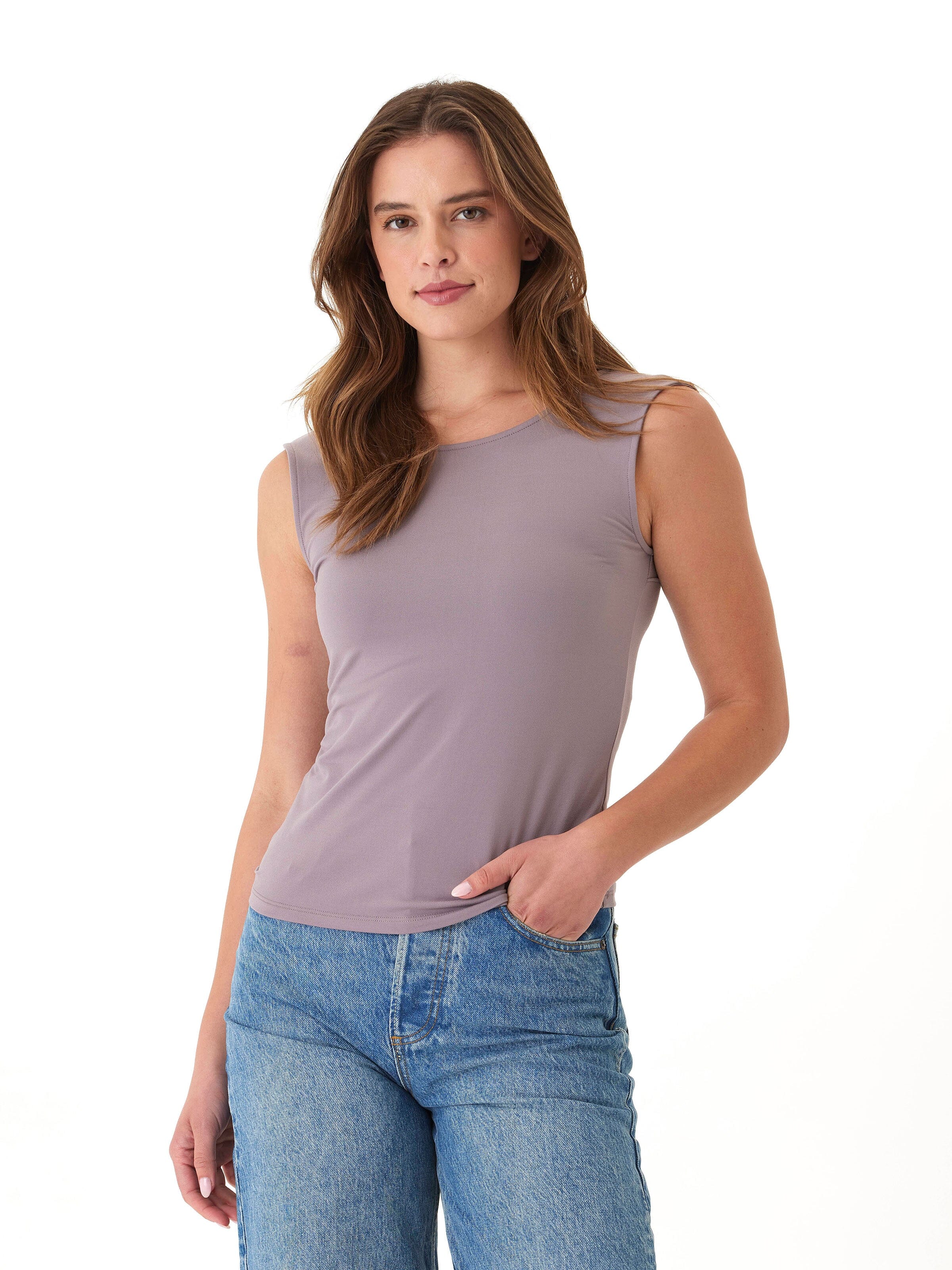 A woman wearing the minimalist Antonia Luxe Jersey sleeveless fitted top in dusty mauve