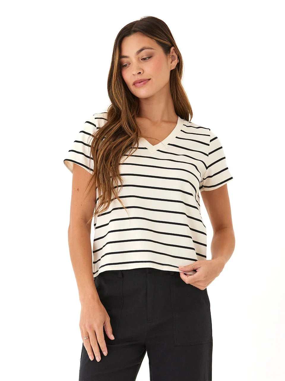 Woman wearing a Maxine Caribbean striped V-neck cropped eco jersey tee in black and off-white
