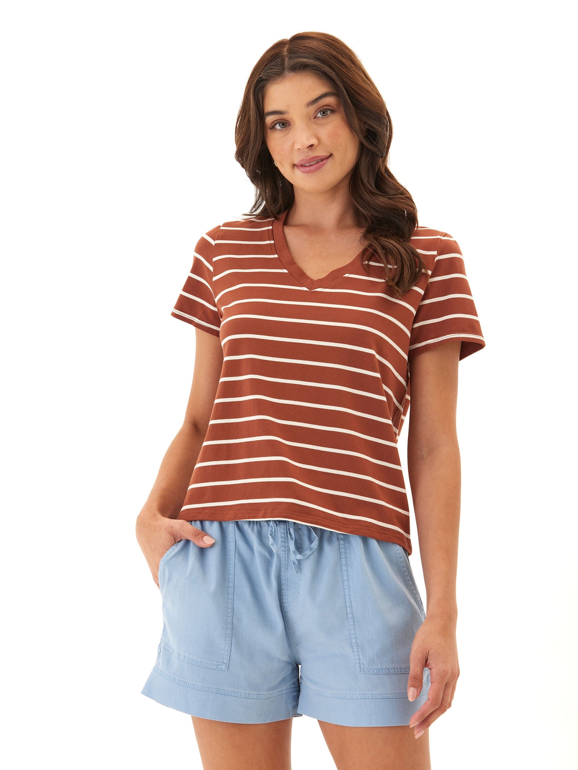 Woman wearing a rust and white striped V-neck cropped tee in Eco Jersey knit