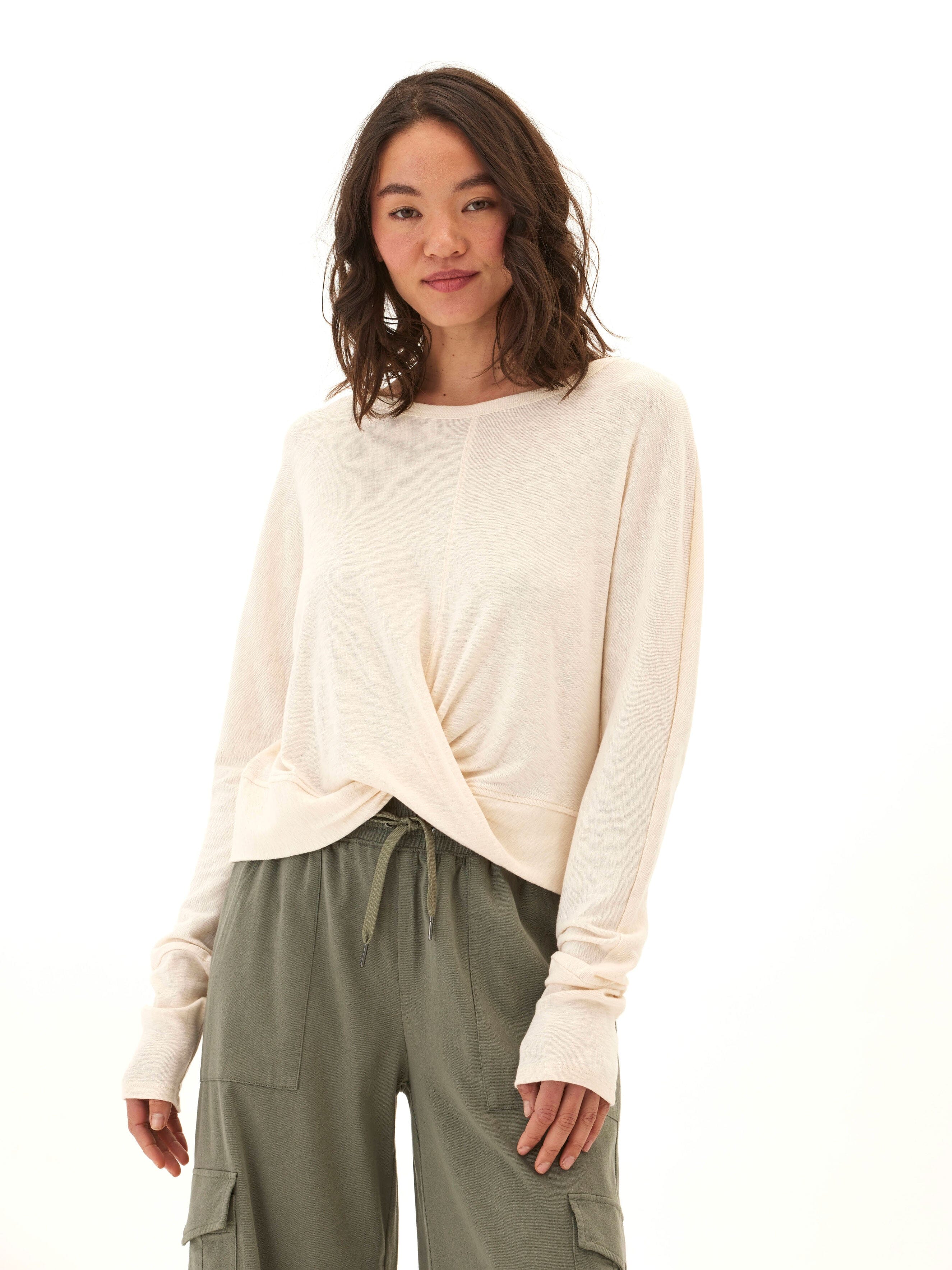 A long sleeve textured jersey top featuring a flattering twist-front detail in a relaxed fit.