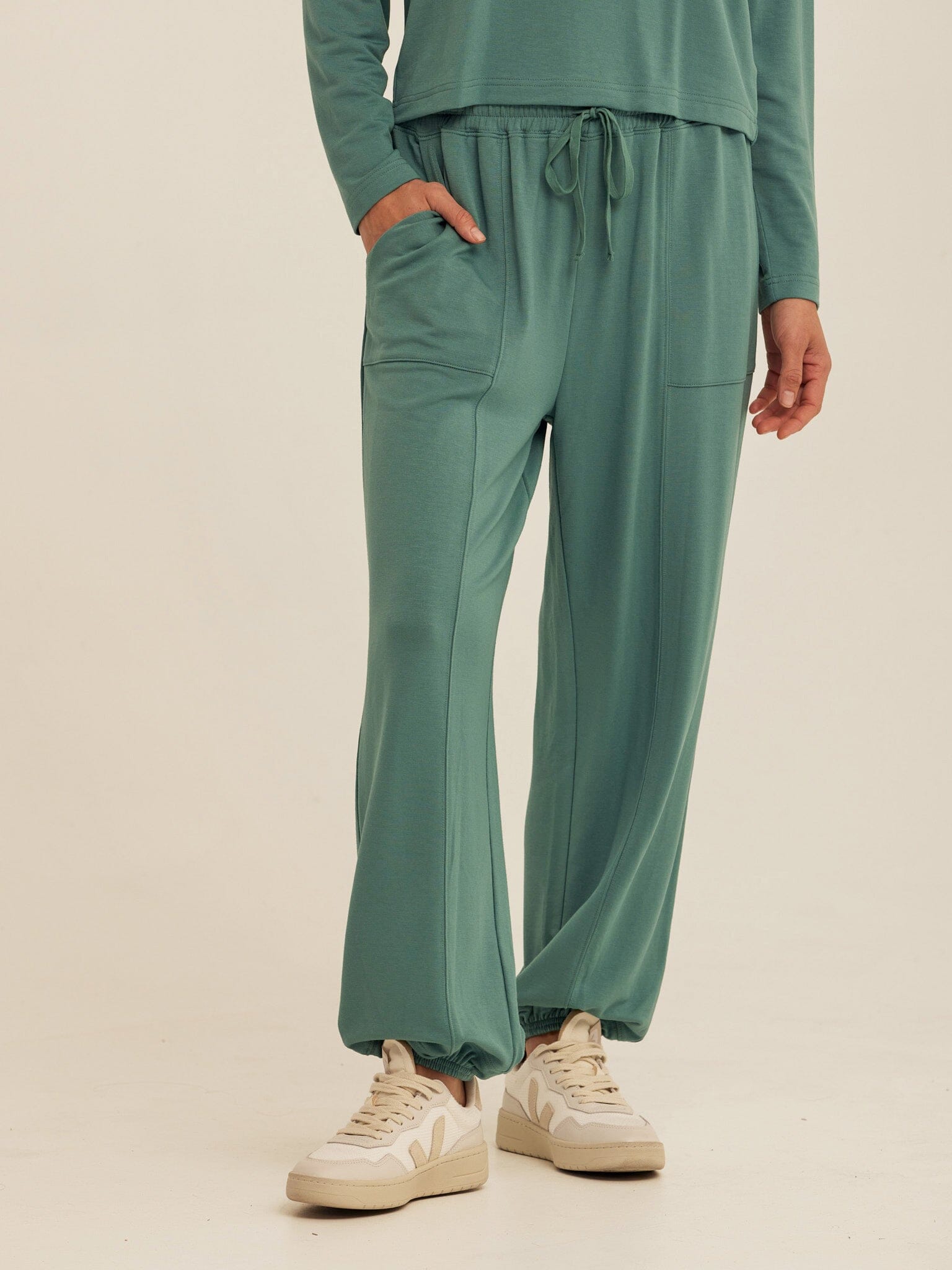 Close up of Lottie Modal Terry Joggers in green featuring elastic cuffs and side pockets