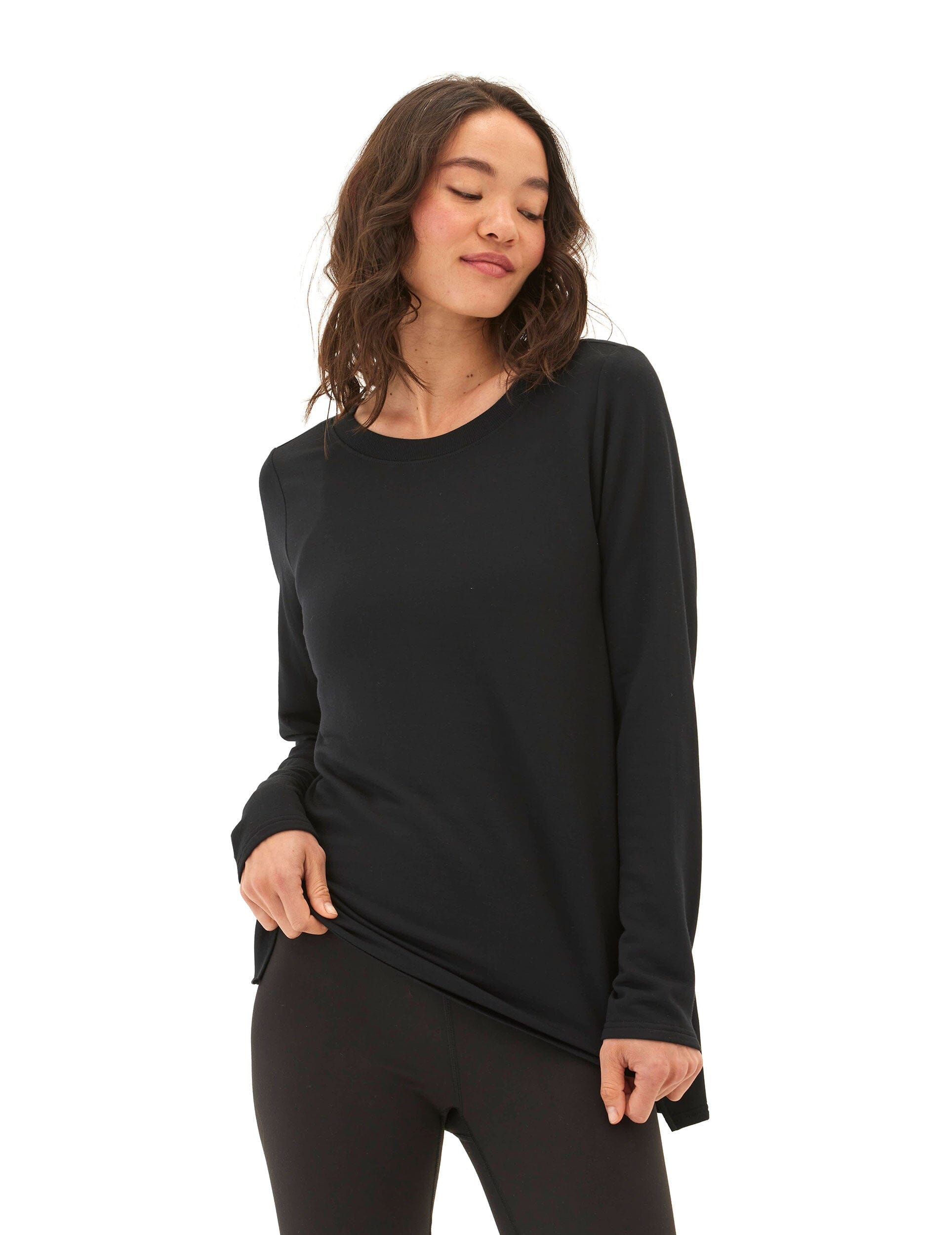 Black Feather Fleece tunic featuring a step-hem design and long sleeves.