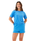 Woman wearing a blue Shirley Jersey Cinched Tee with adjustable side ruching details