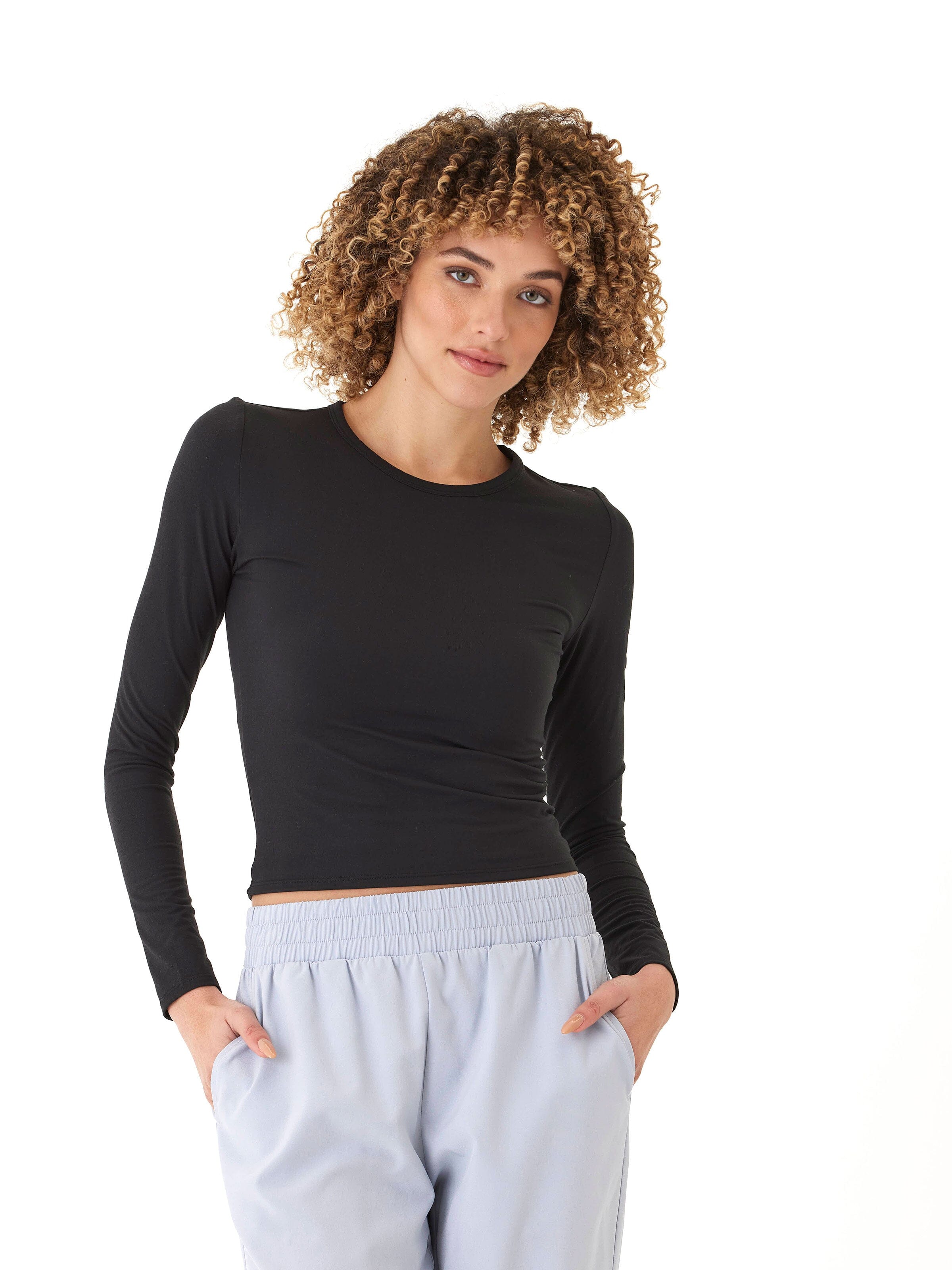 Close-up of the Alice Luxe Jersey Long Sleeve Top in solid black featuring a crew neckline and fitted knit fabric.
