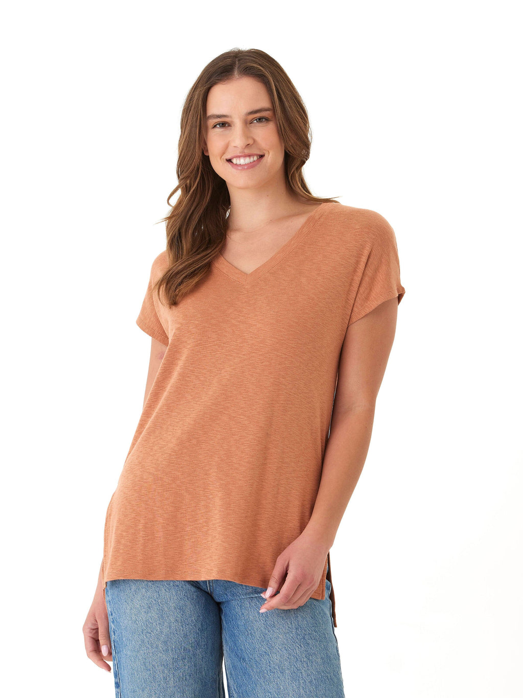 A woman wearing a relaxed fit Elsie textured slub jersey V-neck tee with side slit detail