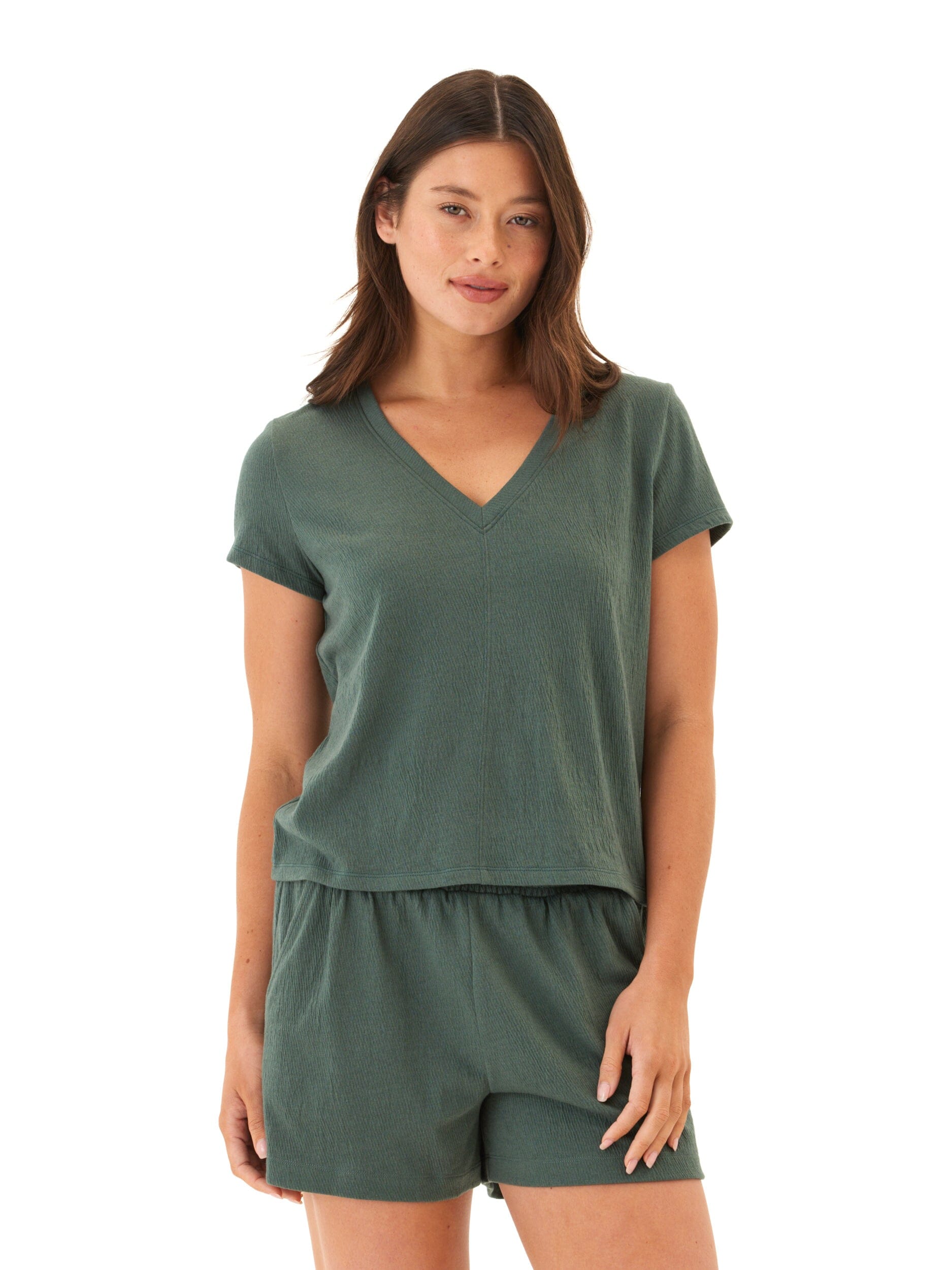 A dark green smocked jersey V-neck top with a relaxed fit and subtle hem detailing.