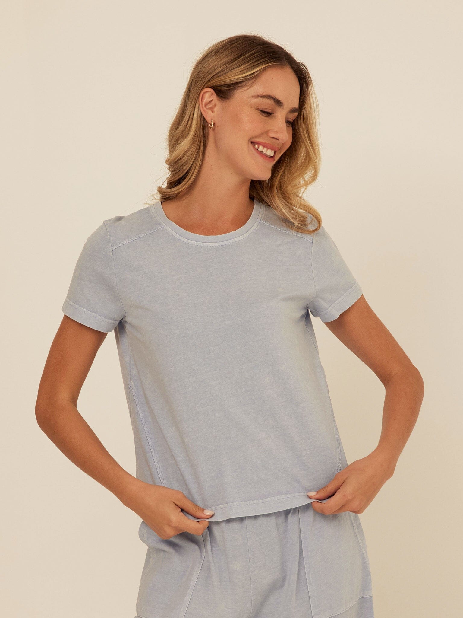 Model wearing a Roselie Mineral Wash Eco Jersey crew neck tee with subtle washed finish
