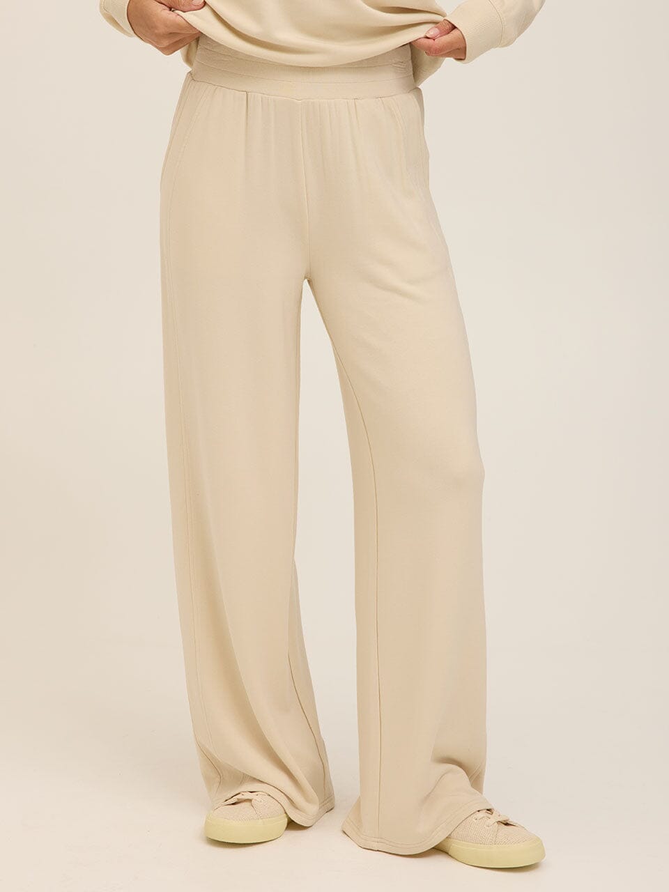 High-rise cream wide-leg sweatpants in soft knit Feather Fleece material