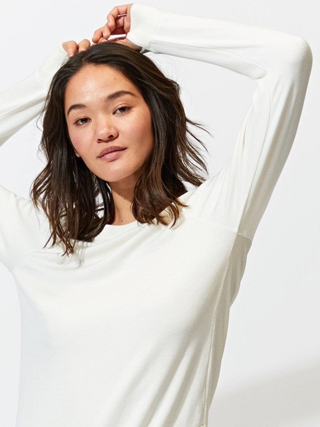 Off-white Leanna Feather Fleece tunic featuring a tulip-hem, styled in a minimalist loungewear aesthetic.