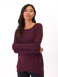 Women wearing a solid burgundy Leanna tulip-hem tunic in brushed TENCEL Modal fleece.