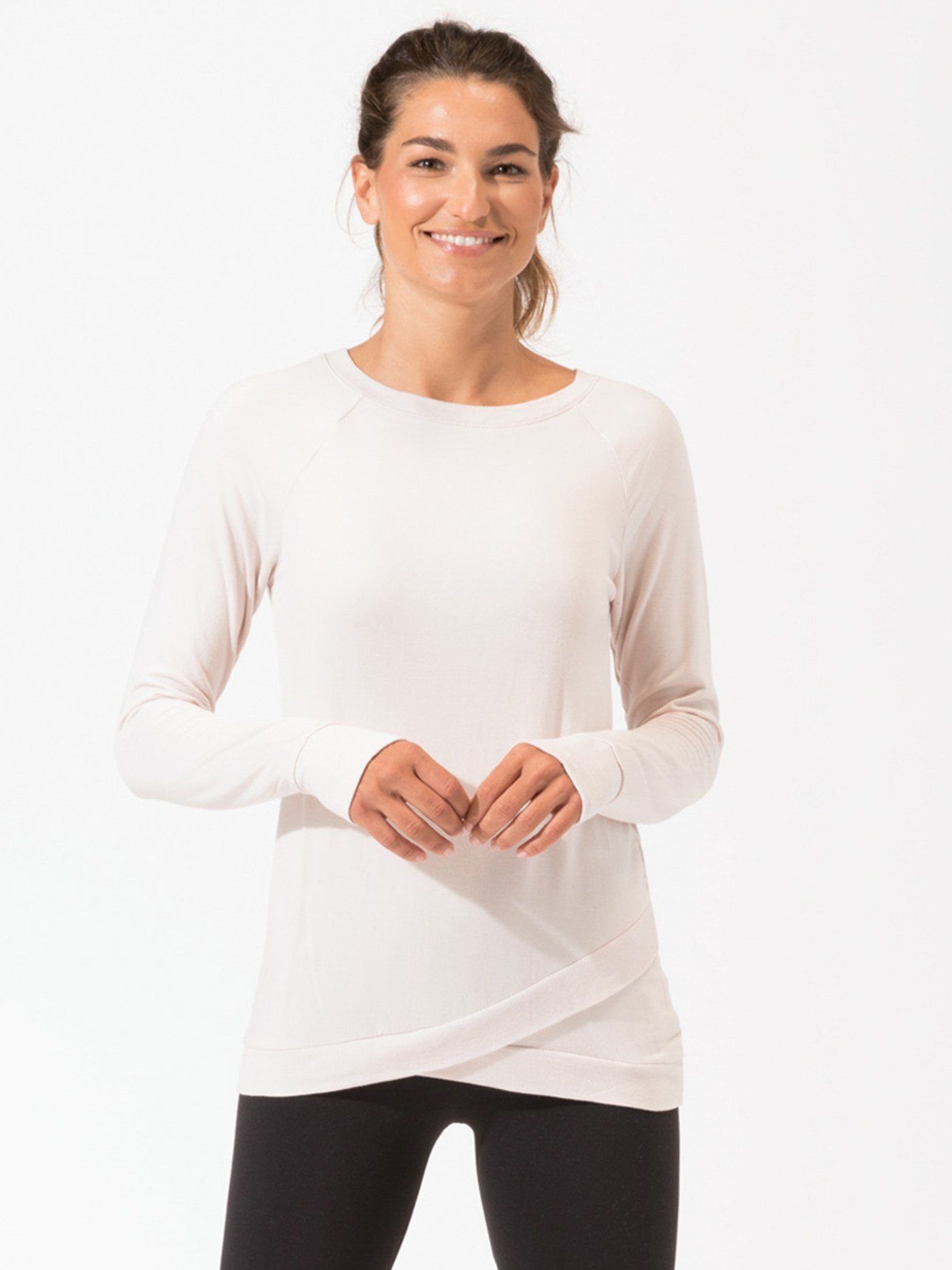Leanna Feather Fleece Tunic featuring a tulip hem in off-white and pale-pink.