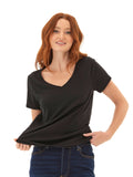 Woman wearing a black Pattie Triblend V-Neck Tee with a minimalist, casual style