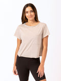 Woman wearing a cropped Maggie Triblend crew neck tee in neutral heathered taupe with a relaxed fit.