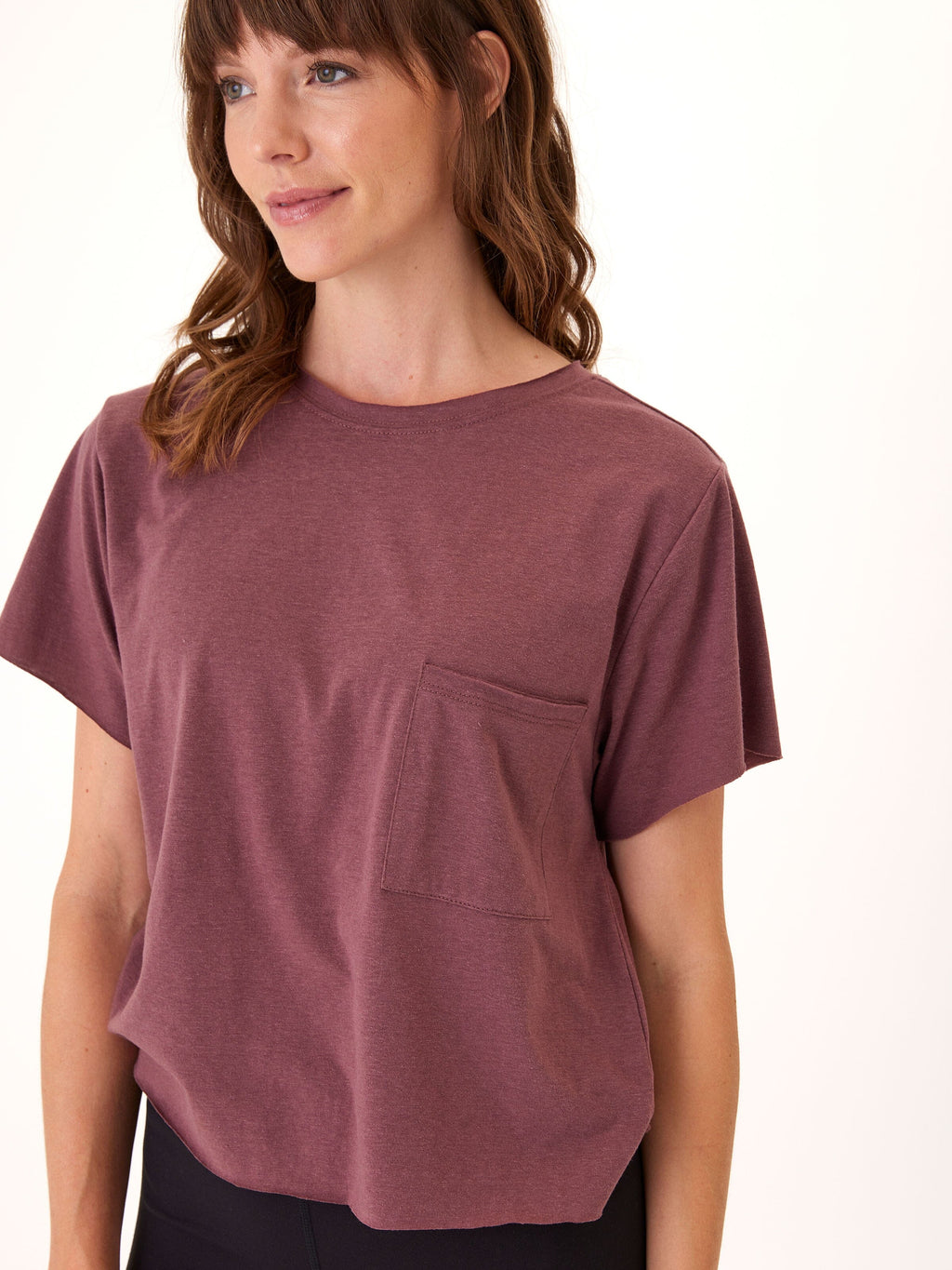 Model wearing the Maggie Triblend Tee, a soft organic cotton modal high-waist t-shirt.