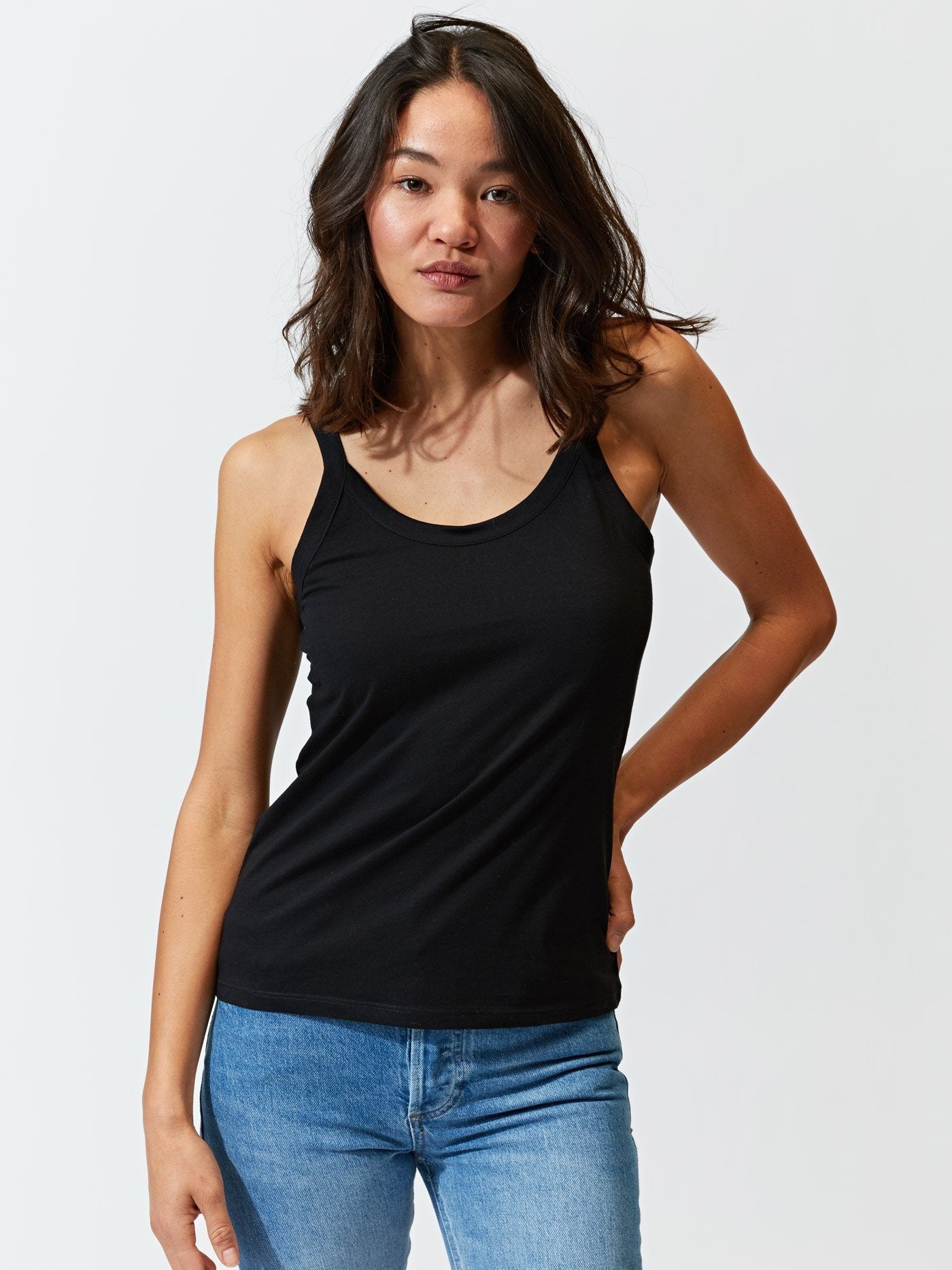 Minimalist black Invincible Cami Tank made from eco-friendly organic cotton.