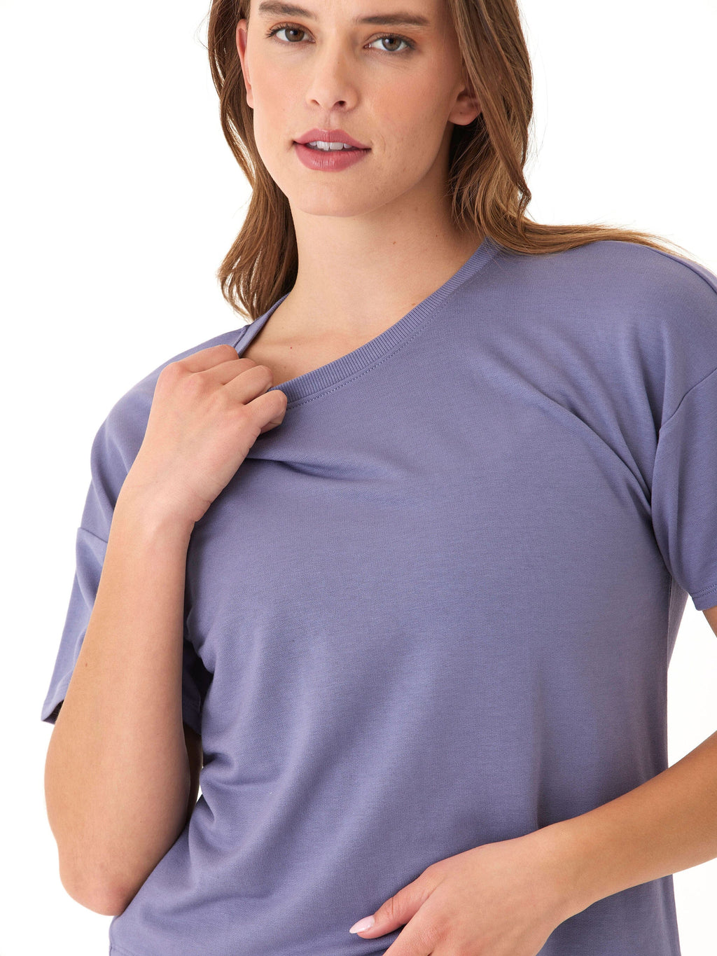 A woman wearing a relaxed-fit purple crew neck tee in soft modal terry knit fabric.