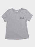 Women wearing a grey organic cotton Wavy Cancel Plastic graphic t-shirt in a casual minimalist style.