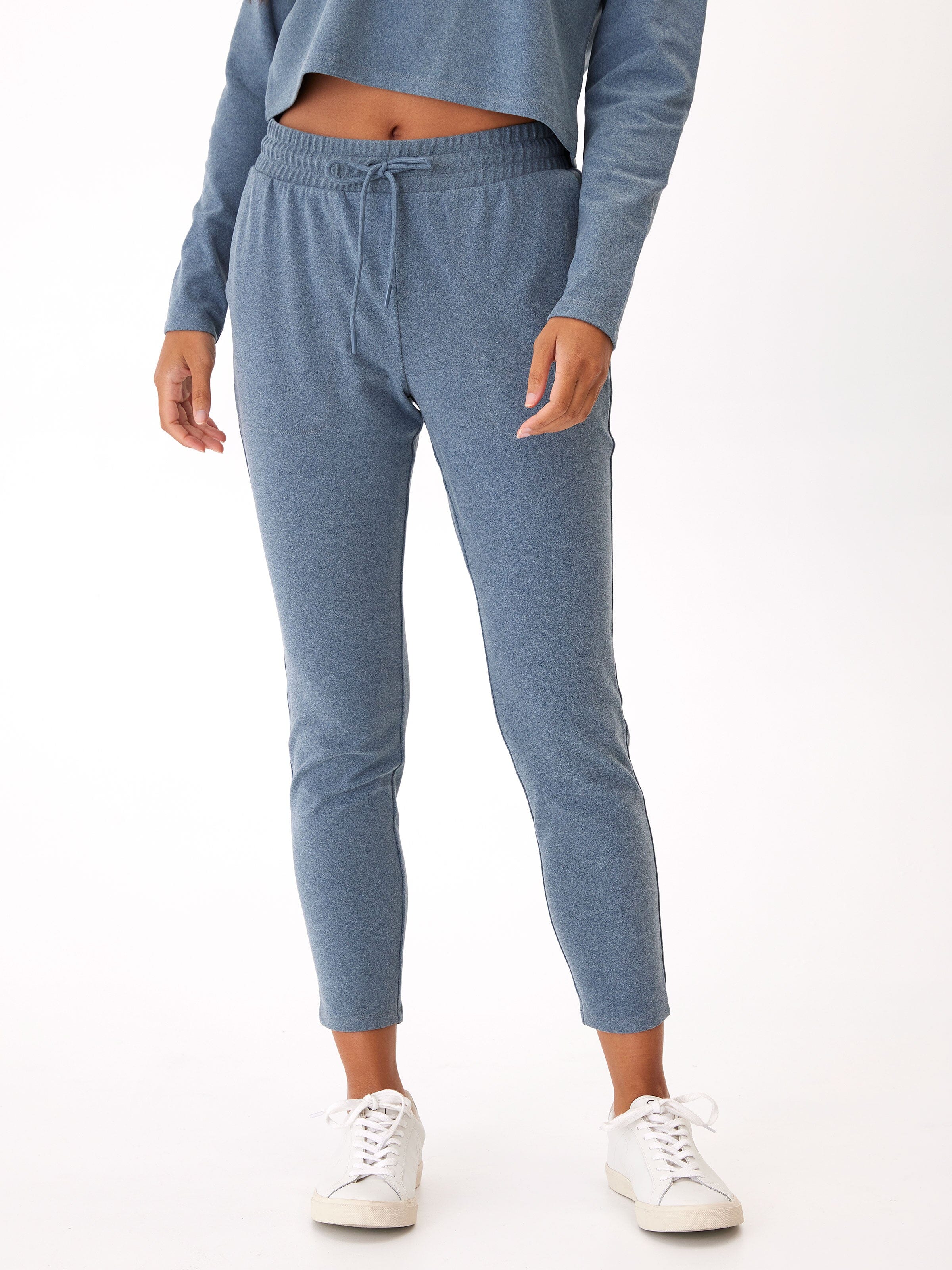Women wearing Lacey Luxe Fleece Joggers in muted heathered slate blue with a tapered fit.