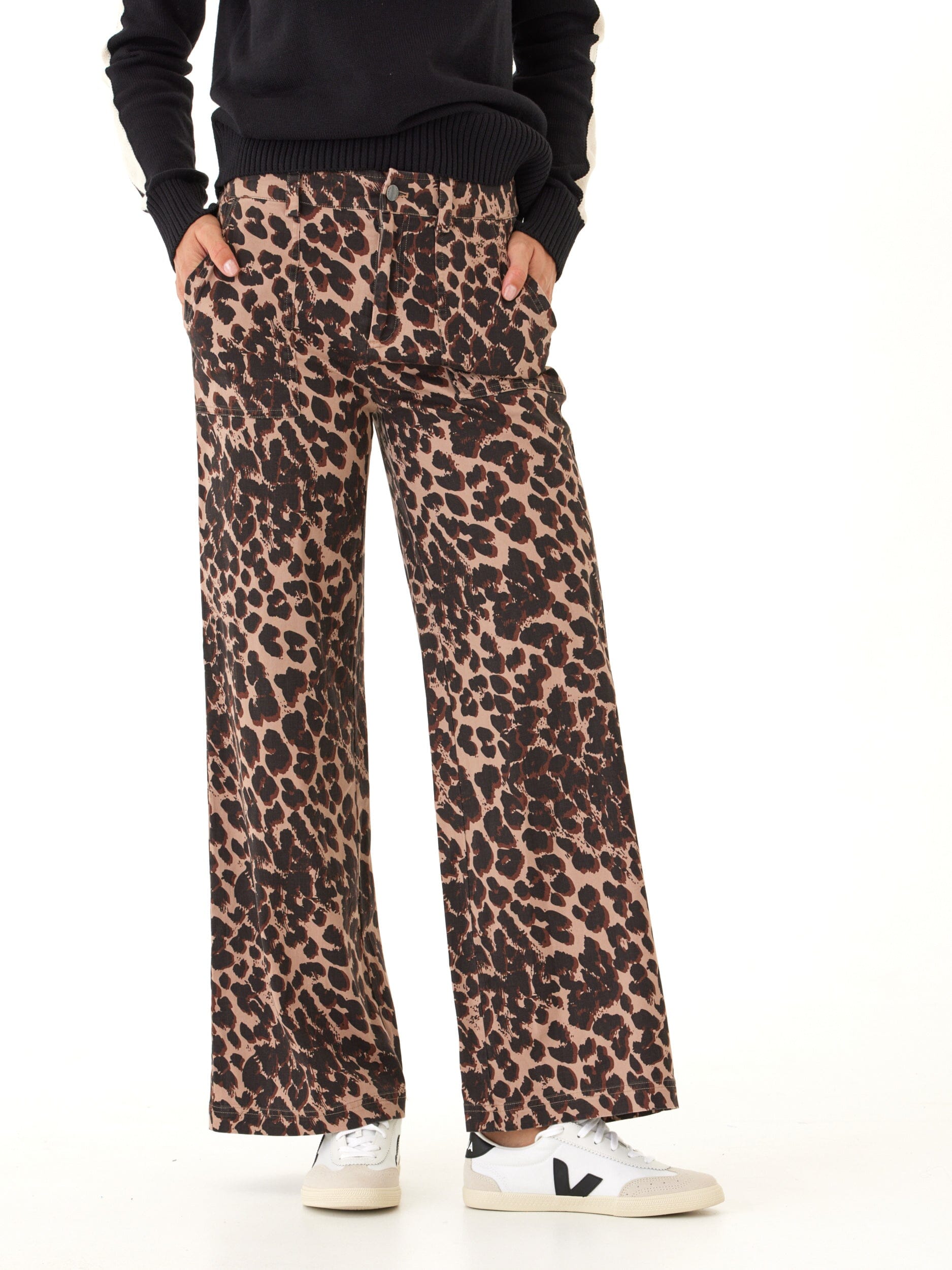 Close up of a woman wearing leopard print stretch twill wide leg pants.