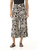 Model wearing Alora Island Flora Print Woven Capri Pant with a cropped wide-leg silhouette and side pockets