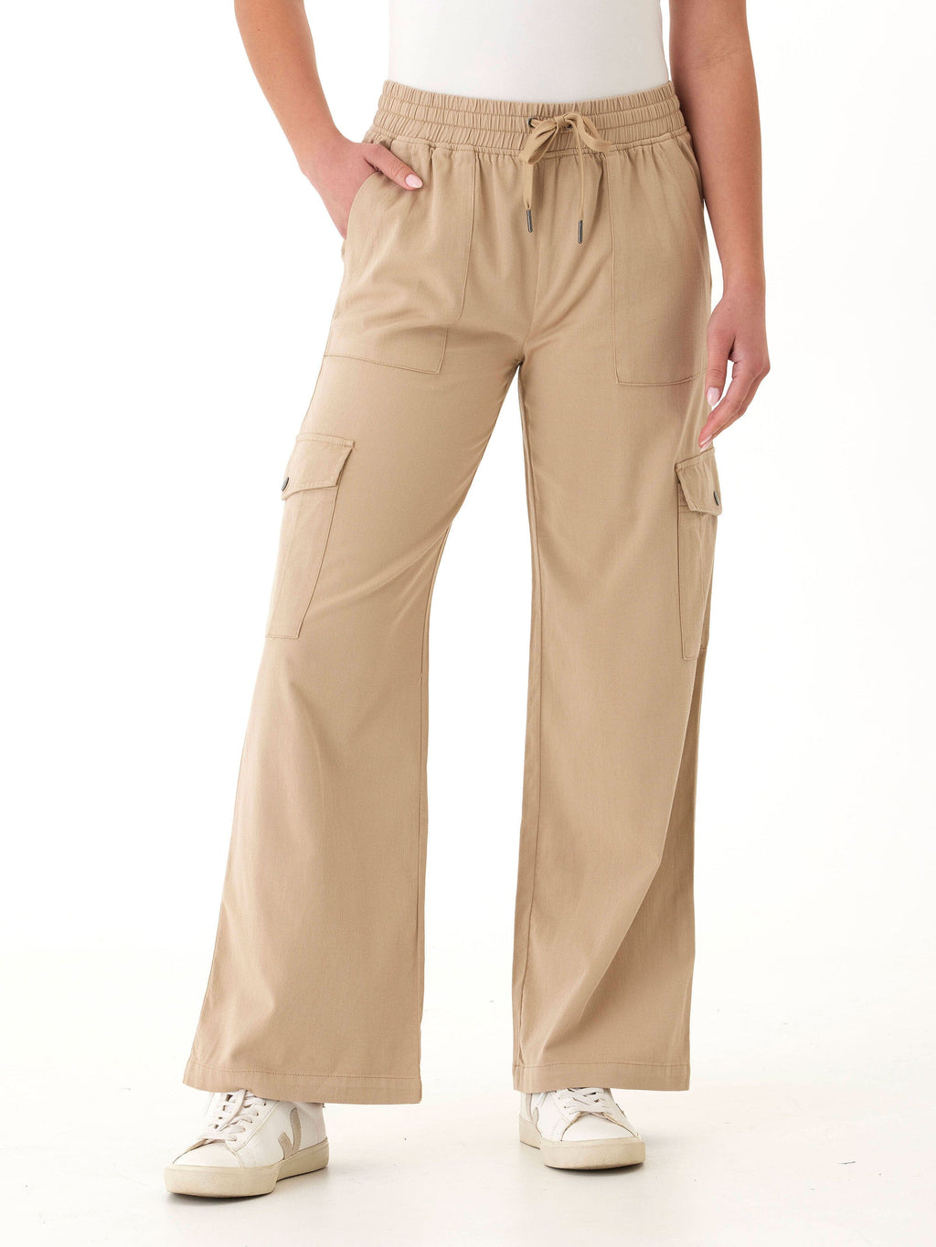 Woman wearing Eila wide leg cargo pants in khaki styled for a modern utility look.