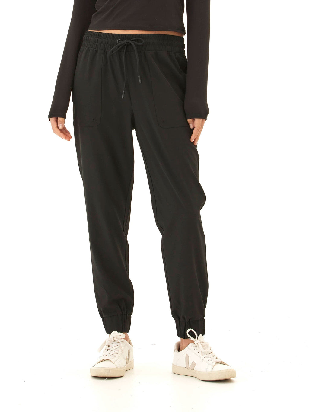 A pair of solid matte black Trysha Ultrastretch Woven Joggers with a tapered silhouette and pull-on elastic waistband.