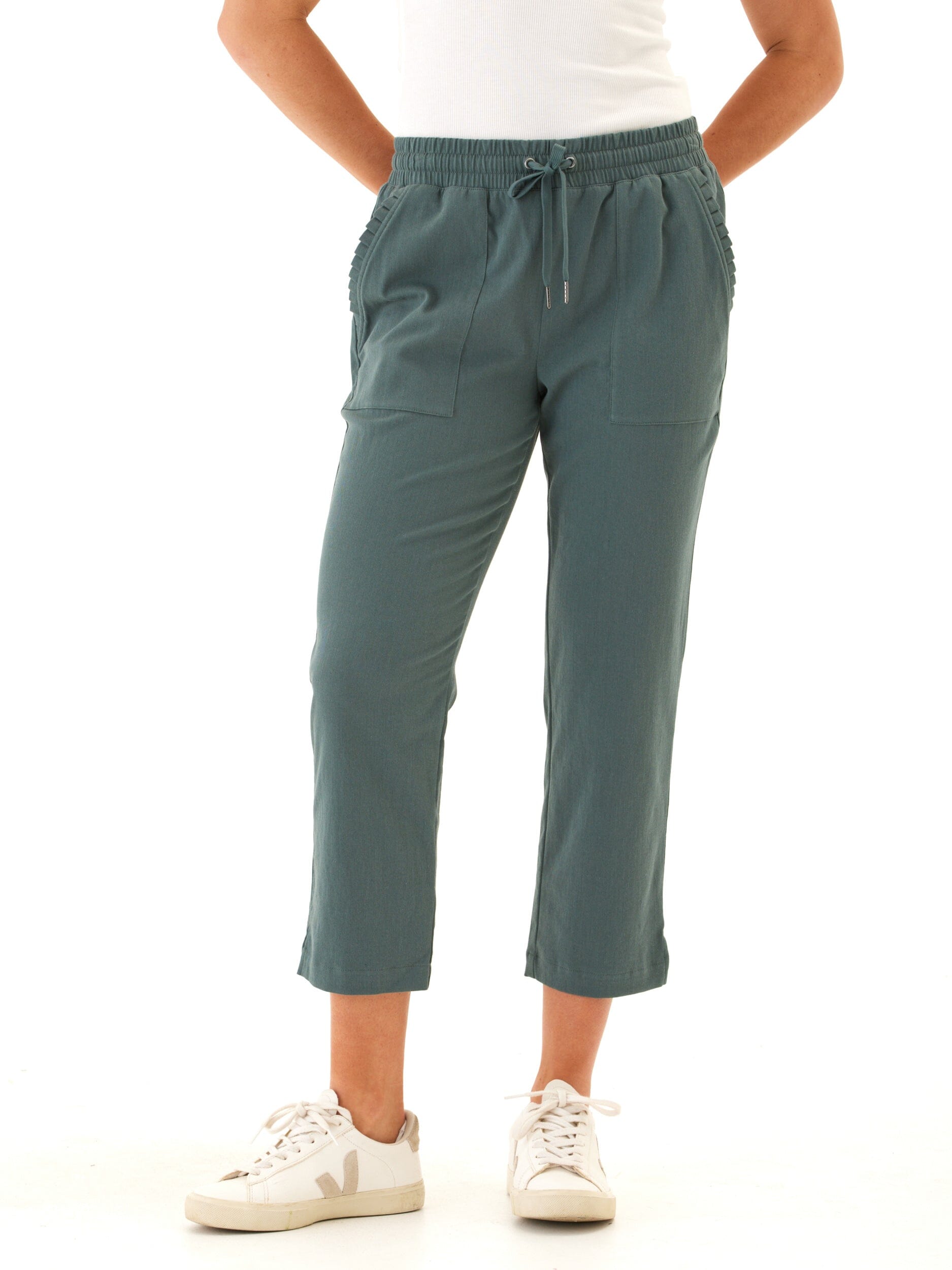 Women wearing comfortable teal-green stretch twill capri pants with an elastic drawcord waistband.