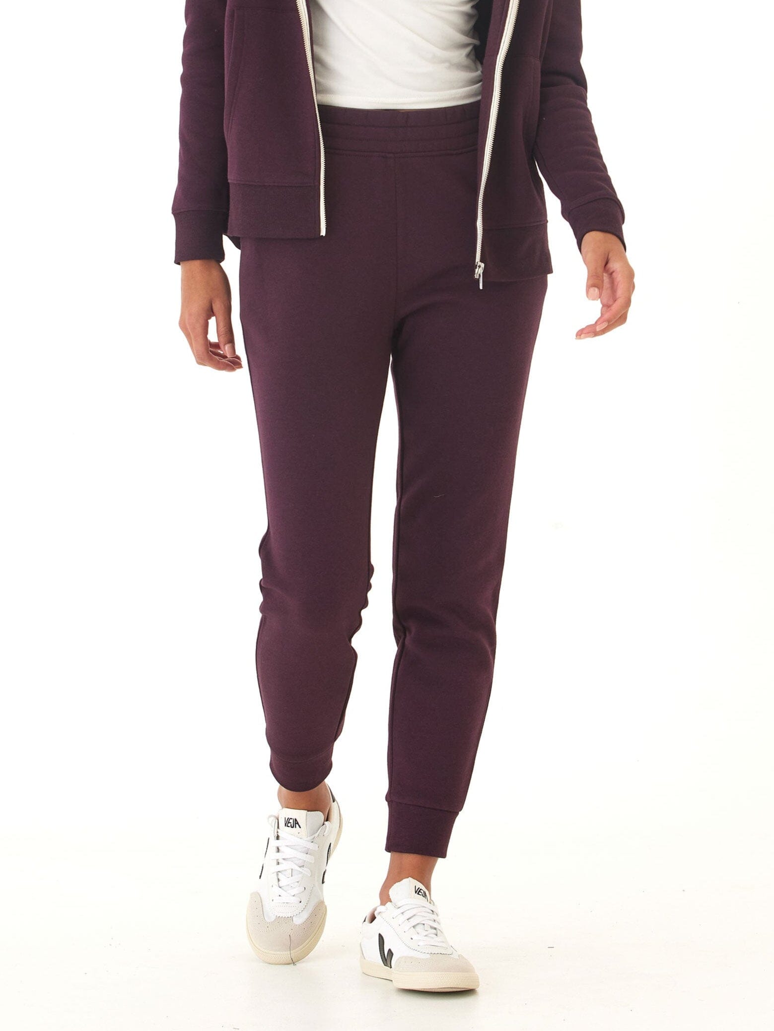 Woman wearing dark purple Rowena Triblend Fleece Joggers with a relaxed, tapered fit.