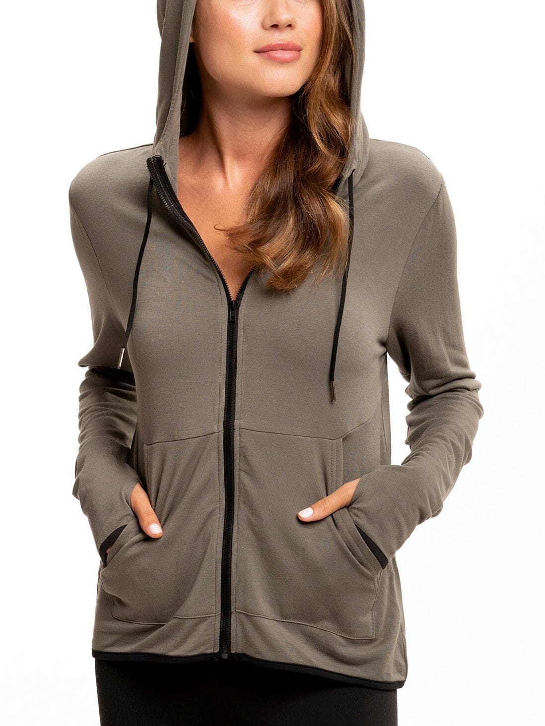 Close-up of the Sybil FeatherLoop Athleisure Jacket showing the slim-fit silhouette, pouch pocket, and thumb holes.