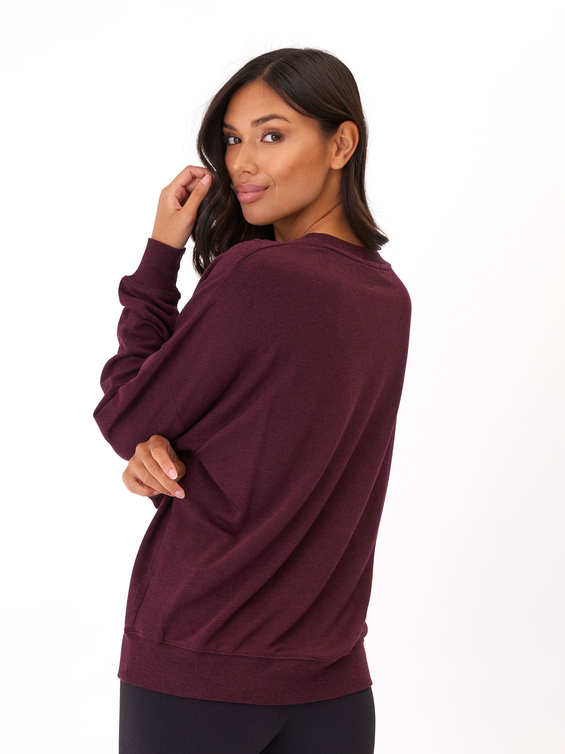 Model wearing a comfortable, relaxed-fit Core Feather Fleece crew neck sweatshirt in a minimalist design.
