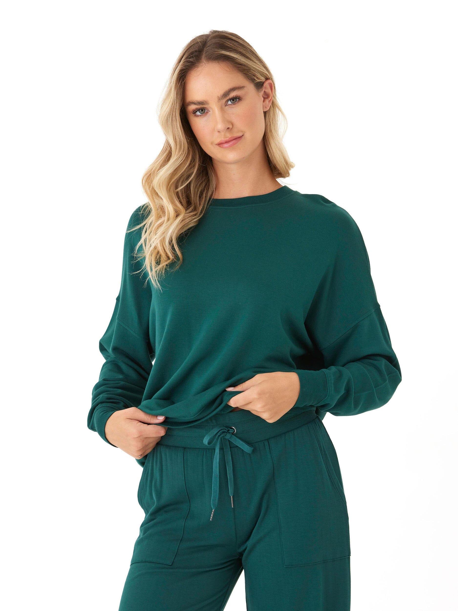Model wearing a cozy Core Feather Fleece Sweatshirt with a relaxed fit and crew neckline.