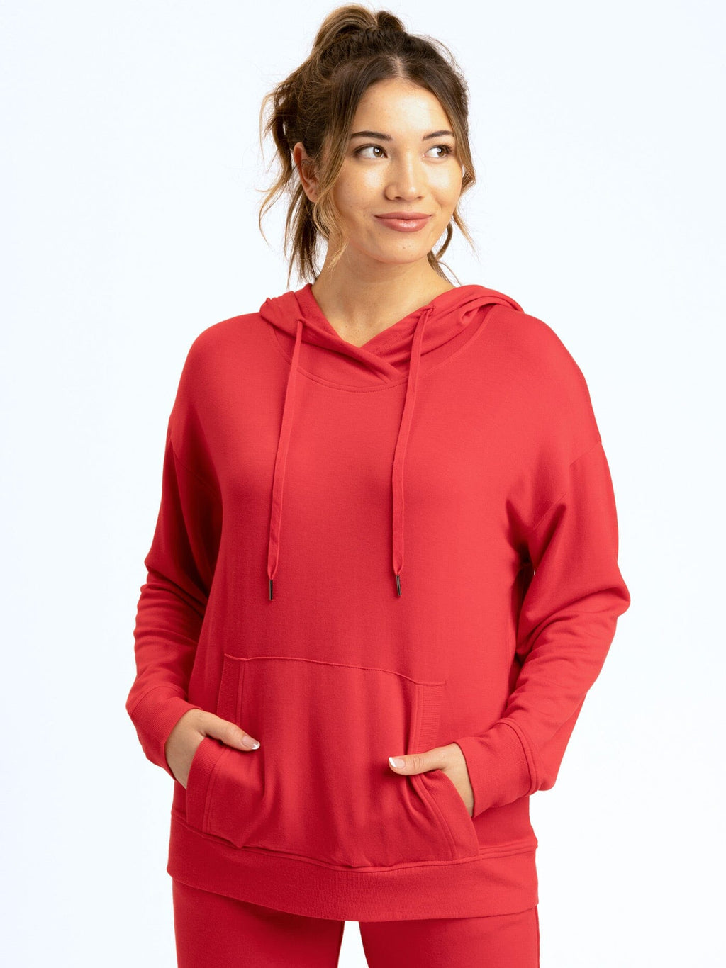 Close-up of the soft texture and relaxed fit of the Madge Feather Fleece Pullover Hoodie in a neutral tone.