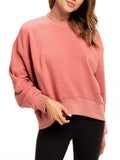 Model wearing a cozy Naia Crop Pullover in ultra-soft triblend fleece with rib trim details