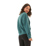 Naia crop pullover in teal and forest green featuring oversized fit and rib-knit trim details