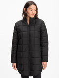 Woman wearing the Azima Packable Long Puffer Jacket in black with a long straight silhouette.
