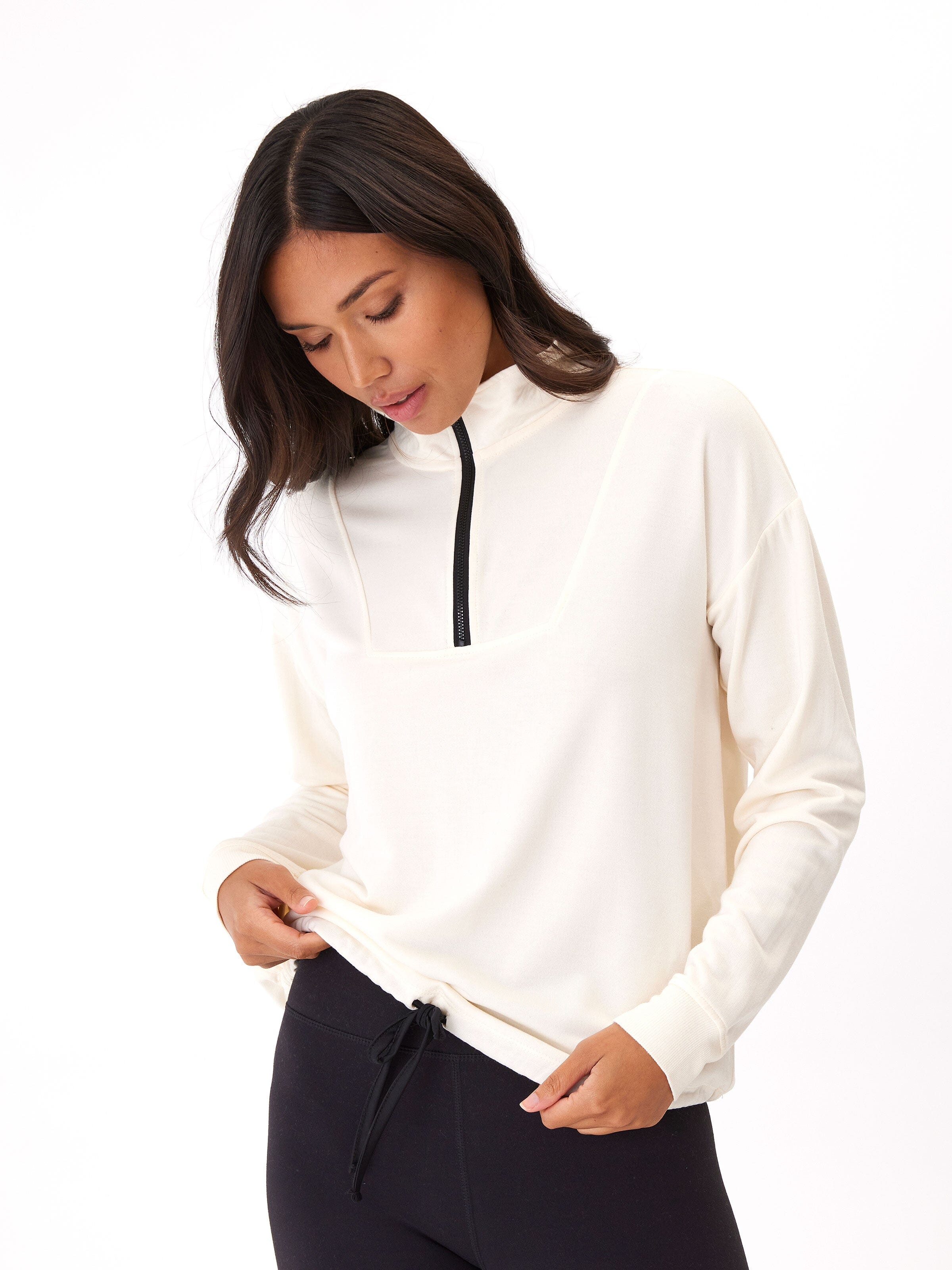 Nyla Feather Fleece Half Zip Pullover in a relaxed fit with quarter zip and drawstring detail.