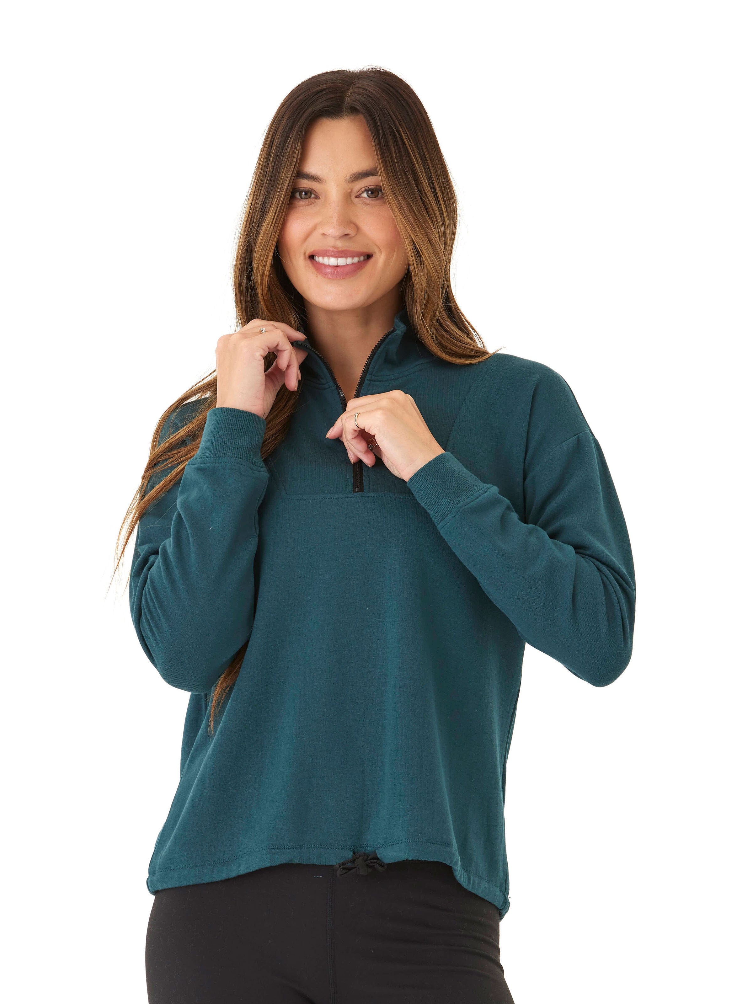Woman wearing a deep teal Nyla Feather Fleece Half Zip Pullover with a collared neck and drawstring detail.