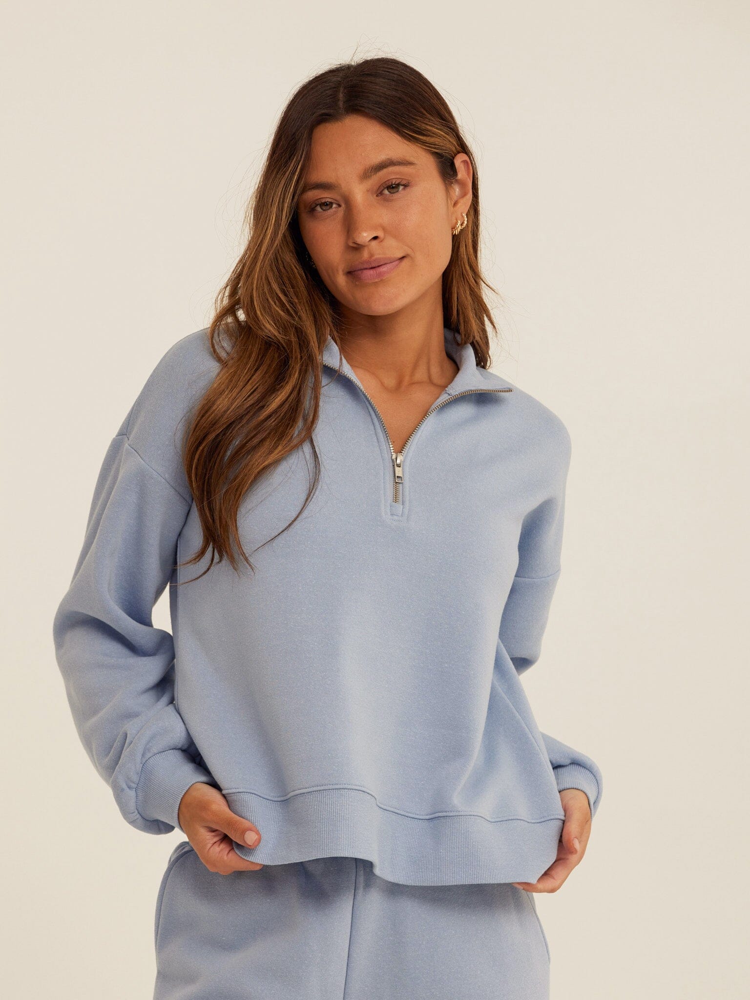 Constance Triblend Fleece Half Zip Pullover in a soft, cozy fit with a high-neck zipper detail.